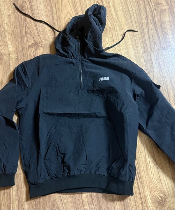 MUSINSA | FCMM Waterproof Half Zip Woven Hoodie - Black