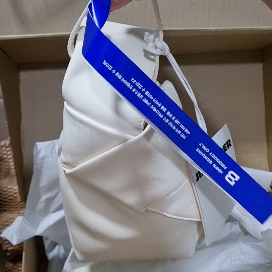 MUSINSA | JIL SANDER Bow pouch bag - Off-White