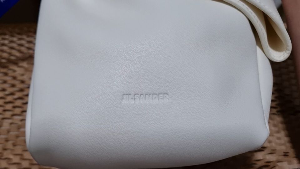 MUSINSA | JIL SANDER Bow pouch bag - Off-White