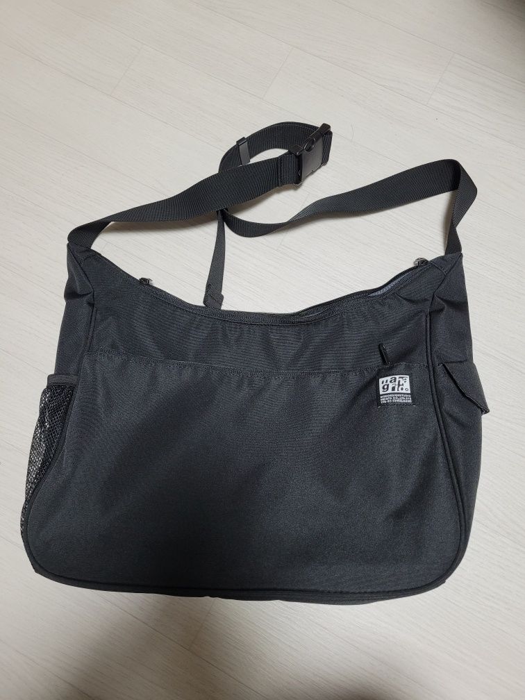 MUSINSA | MAHAGRID ROUND MESSENGER BAG(MG2DSUAB45A)