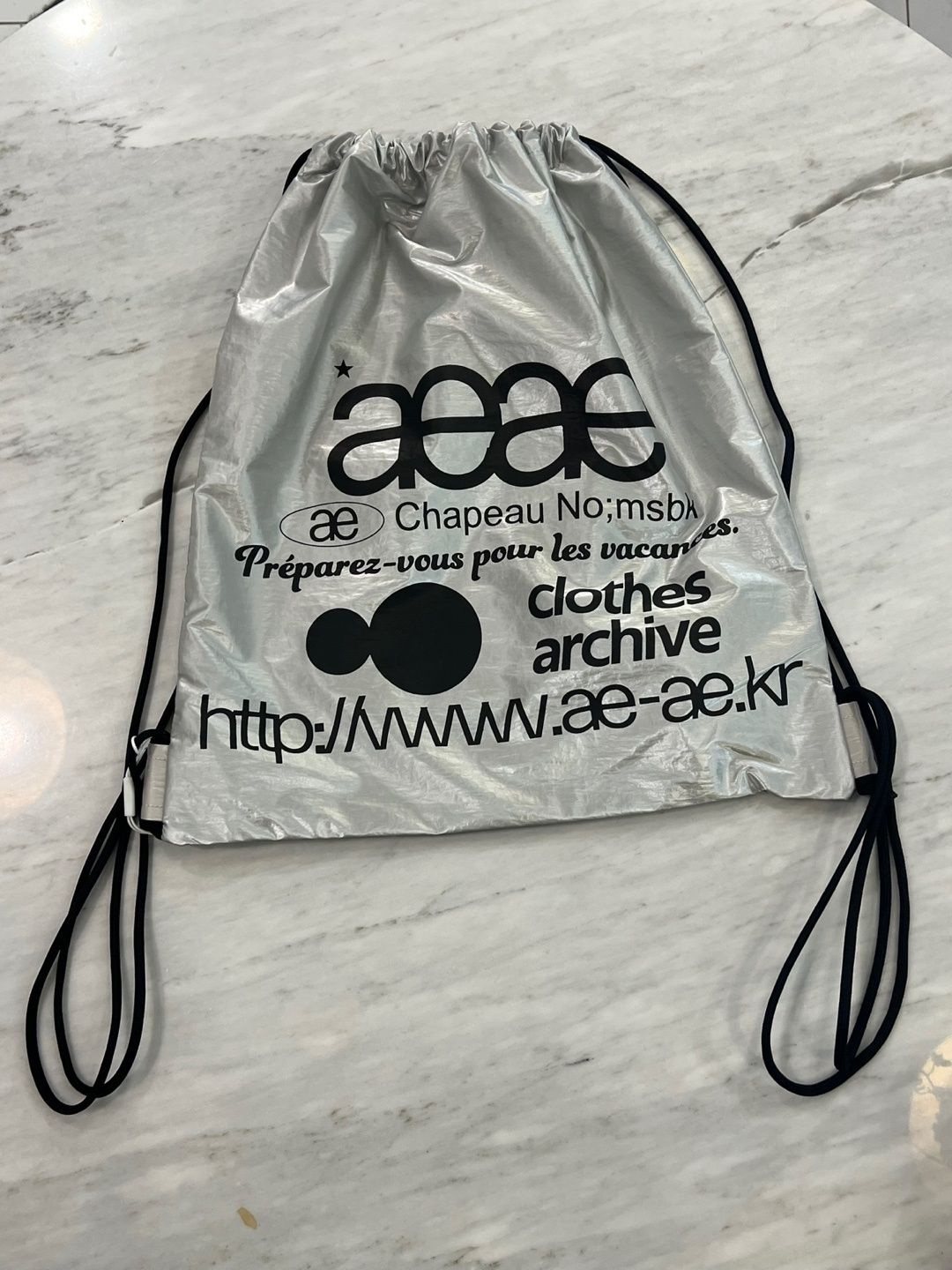 MUSINSA公式 | AEAE Web Logo Gym Sack -[SILVER]