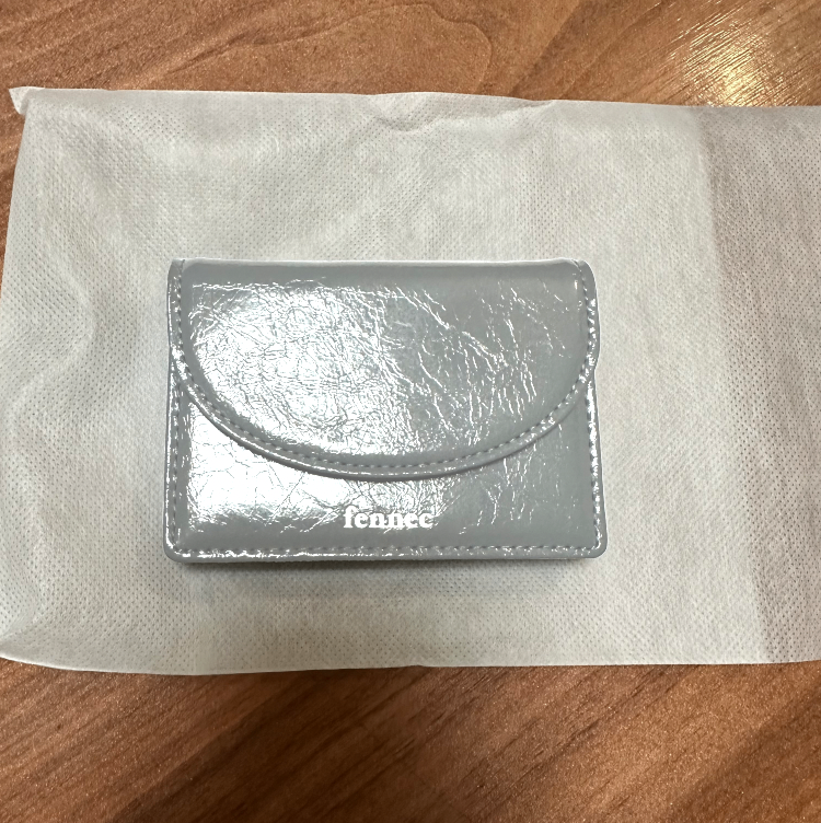 MUSINSA | fennec CRINKLE HALFMOON MINI WALLET - MID GRAY