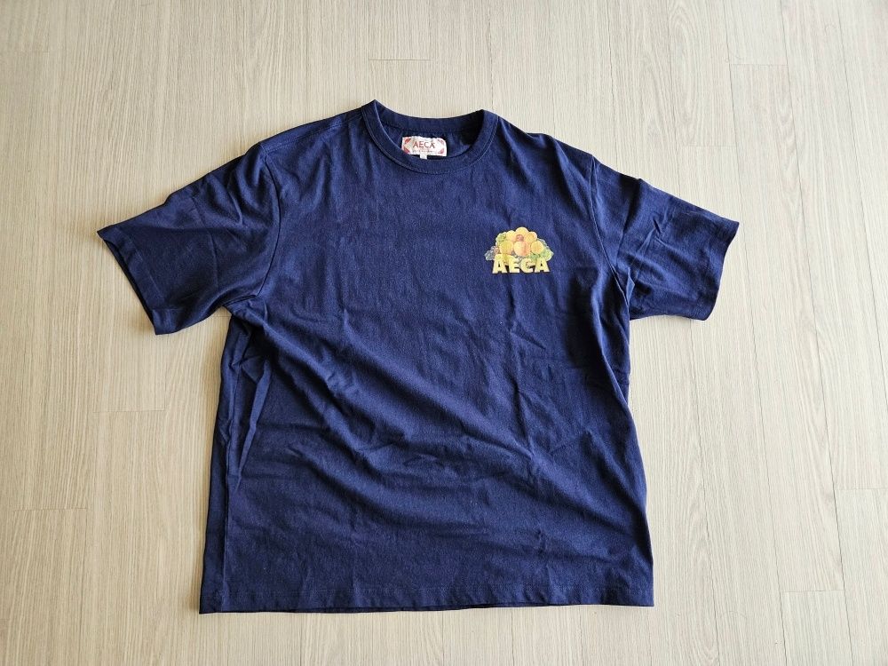 AECA WHITE AECA CAUTION Tシャツ NA AECAWHITE