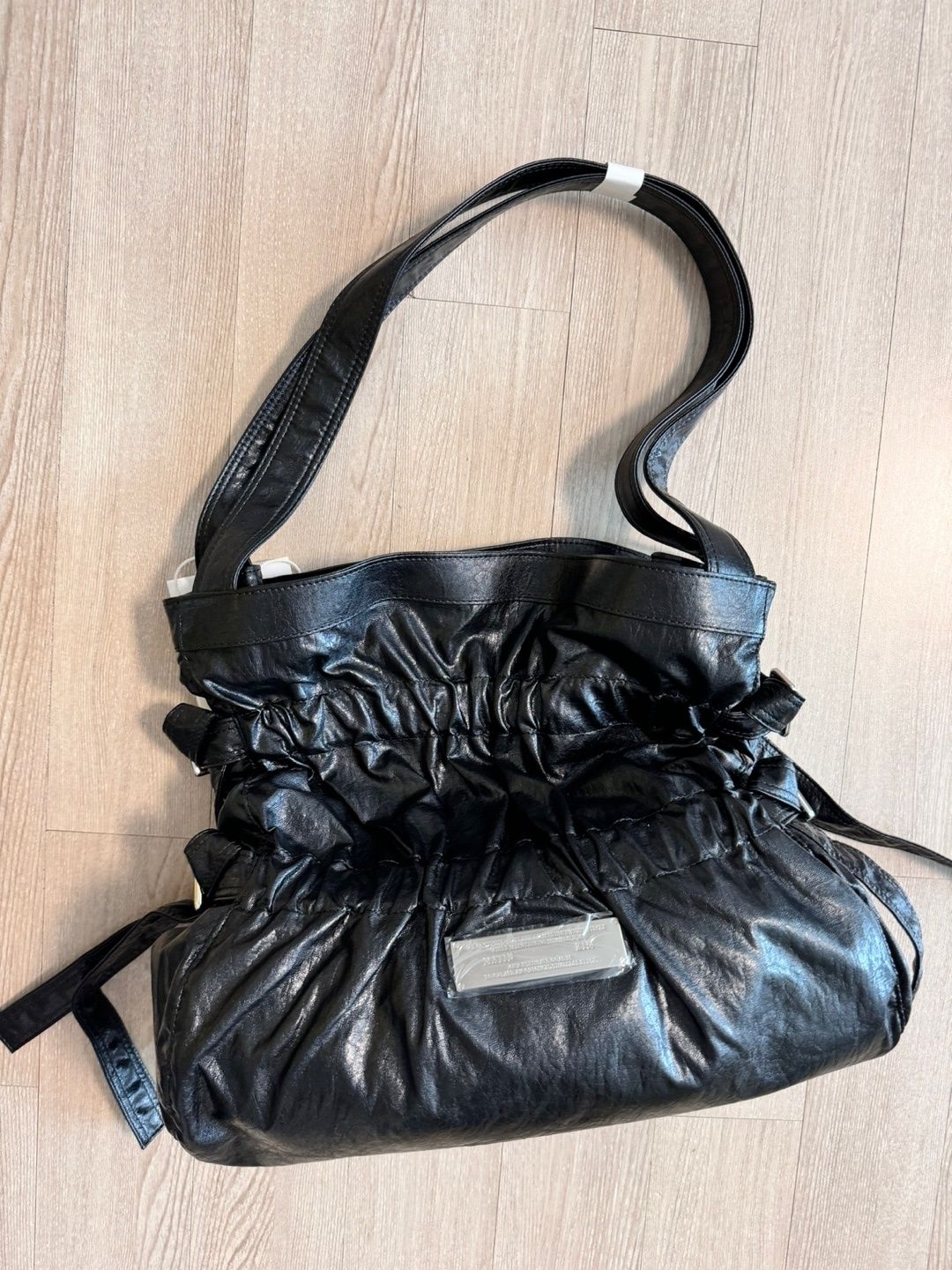 MUSINSA | MATIN KIM FAUX LEATHER SEASHELL BAG IN BLACK