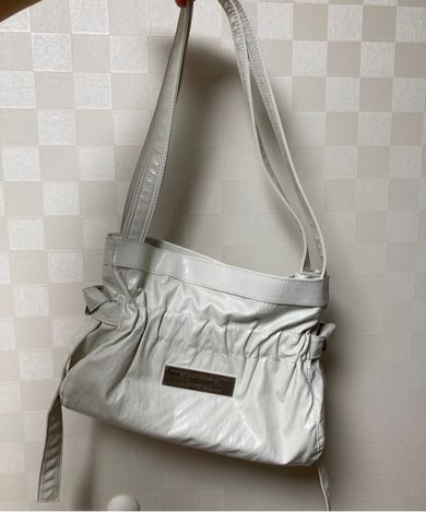 MUSINSA | MATIN KIM FAUX LEATHER SEASHELL MINI BAG IN IVORY