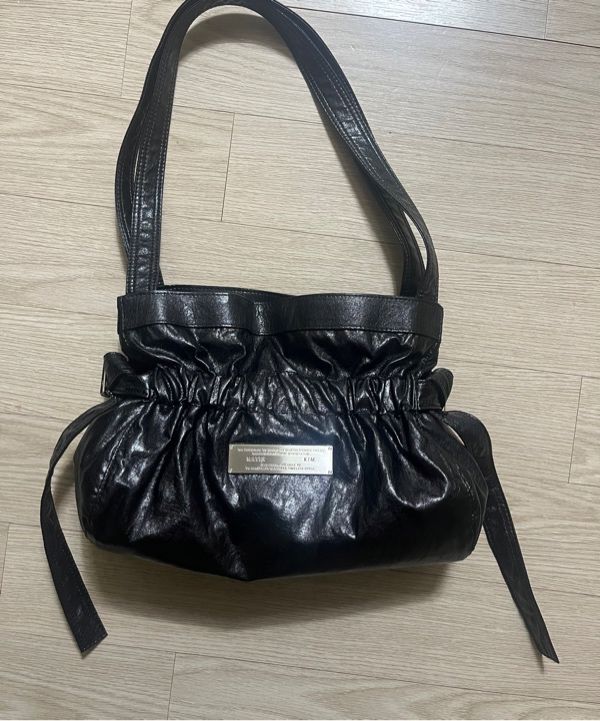 MUSINSA | MATIN KIM FAUX LEATHER SEASHELL MINI BAG IN BLACK
