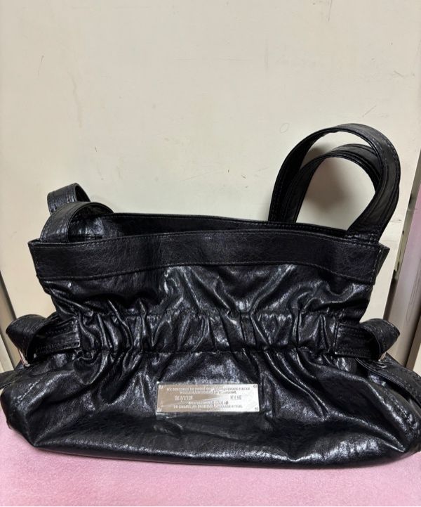 MUSINSA | MATIN KIM FAUX LEATHER SEASHELL MINI BAG IN BLACK
