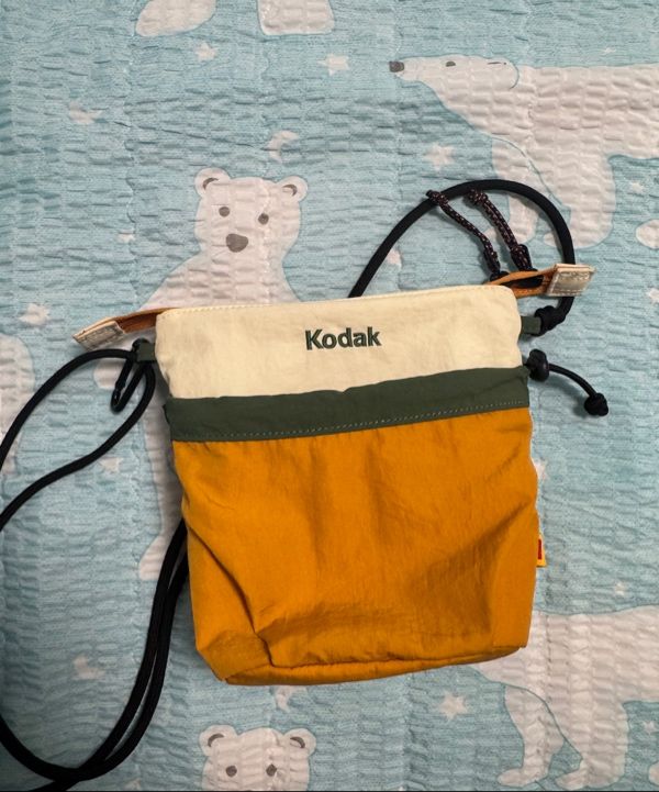 MUSINSA | KODAK Hardy String Mini Crossbody Bag ORANGE
