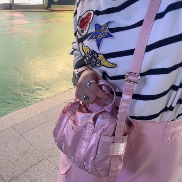 ショルダーバッグ・ポシェット [MATINKIM]glossy logo sporty mini duffel bag in light pink MUSINSA | MATIN KIM GLOSSY LOGO SPORTY MINI DUFFEL BAG IN