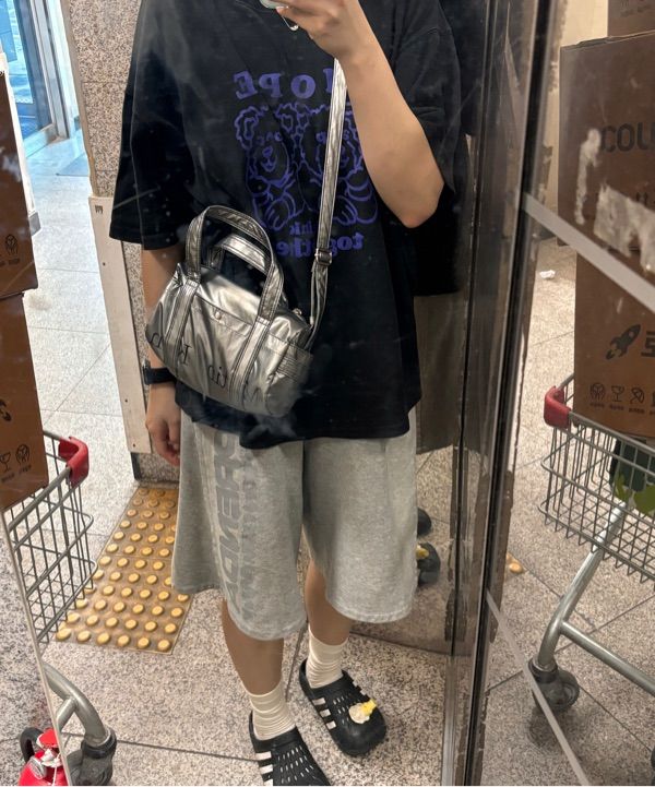MUSINSA | MATIN KIM GLOSSY LOGO SPORTY MINI DUFFEL BAG IN SILVER