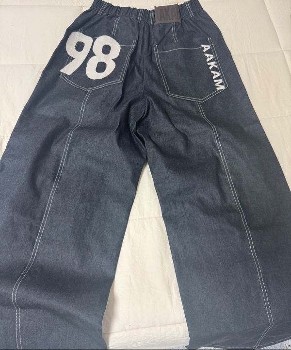 MUSINSA | AAKAM 98 Printed Knee Pin-tuck Denim Pants (Black)