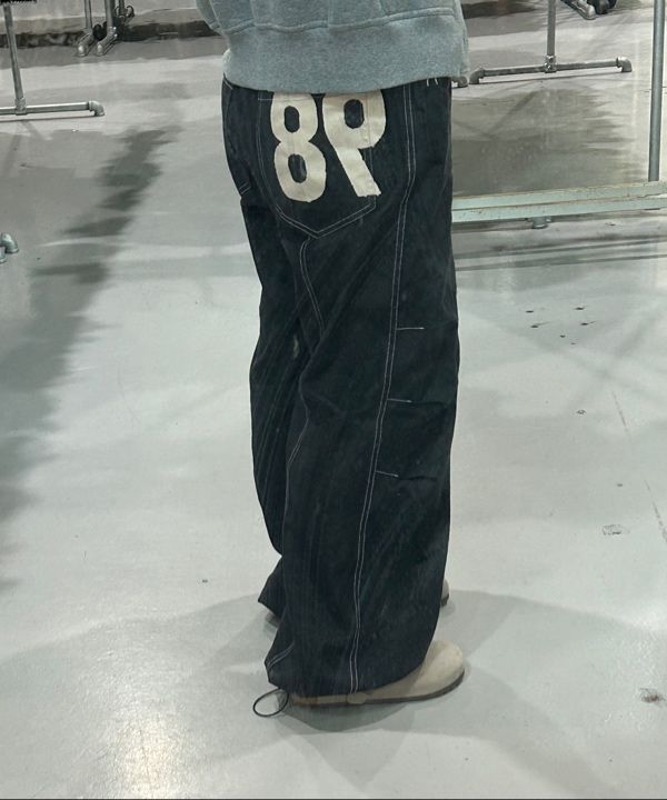 MUSINSA | AAKAM 98 Printed Knee Pin-tuck Denim Pants (Black)