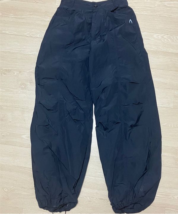 MUSINSA | AAKAM 98 Printed Knee Pin-tuck Nylon Pants (Black)