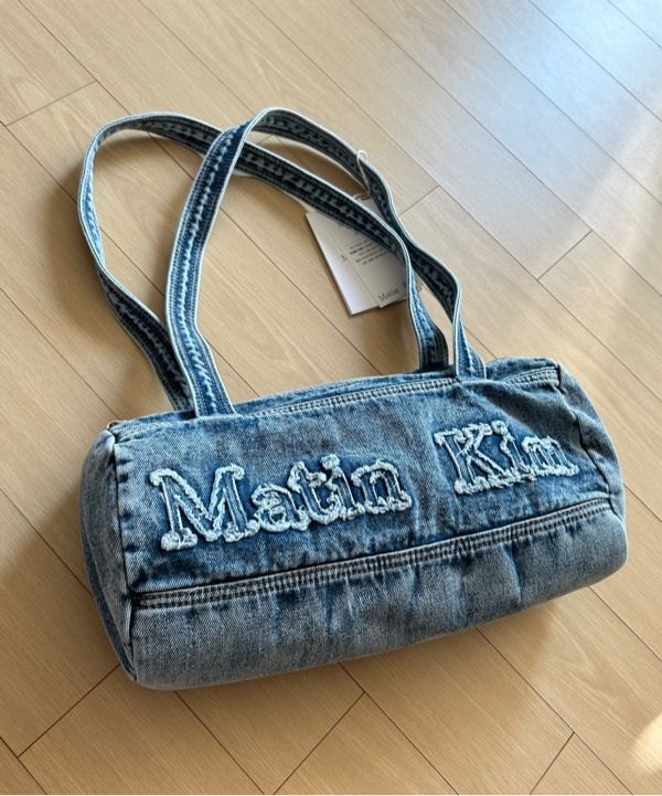 MUSINSA | MATIN KIM LOGO WASHED DENIM DUFFEL BAG IN BLUE