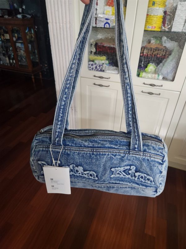 MUSINSA | MATIN KIM LOGO WASHED DENIM DUFFEL BAG IN BLUE