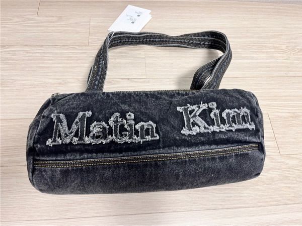 MUSINSA | MATIN KIM LOGO WASHED DENIM DUFFEL BAG IN BLACK