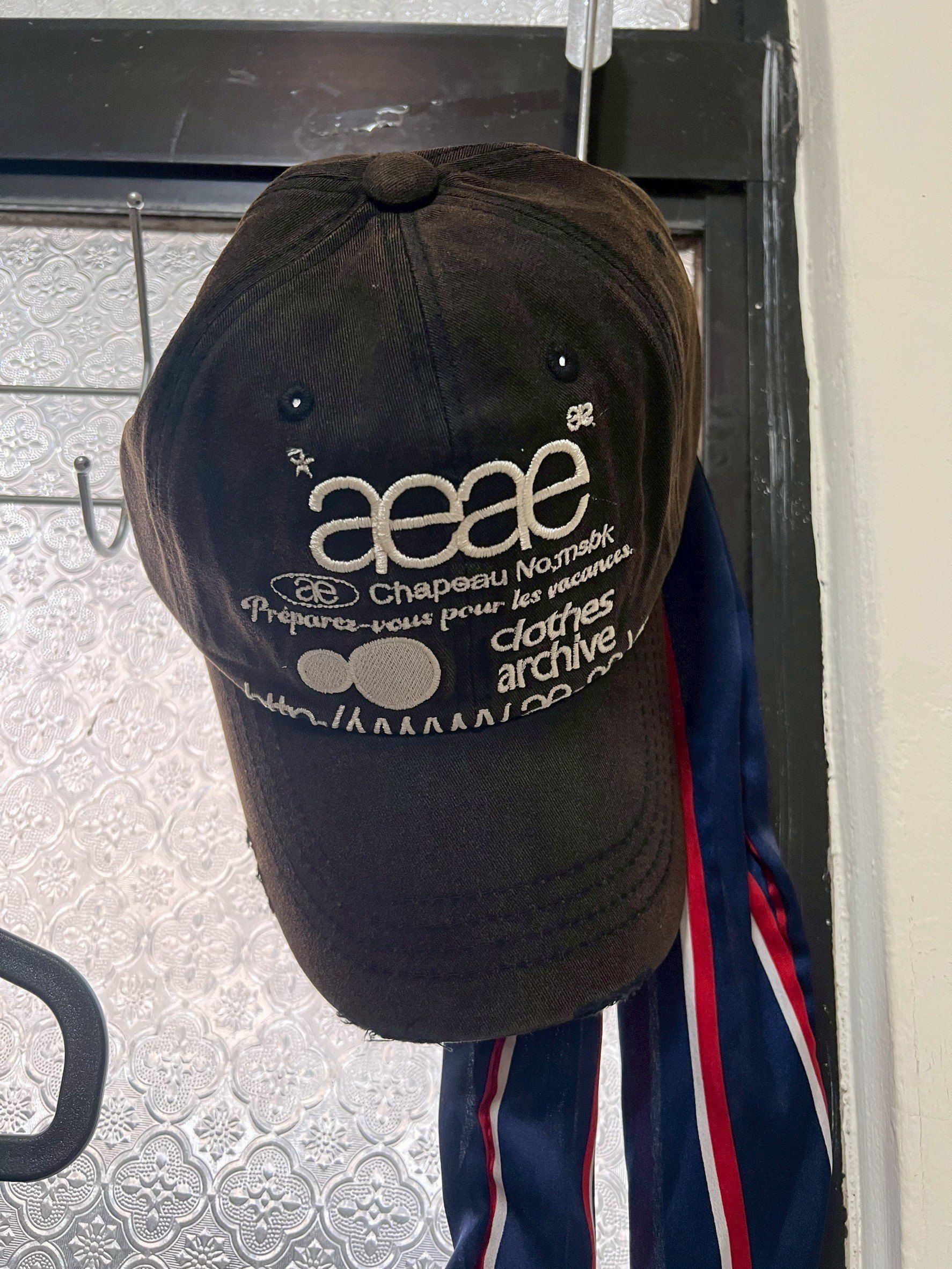 MUSINSA公式 | AEAE WEB LOGO DAMAGED CAP [DARK BROWN]
