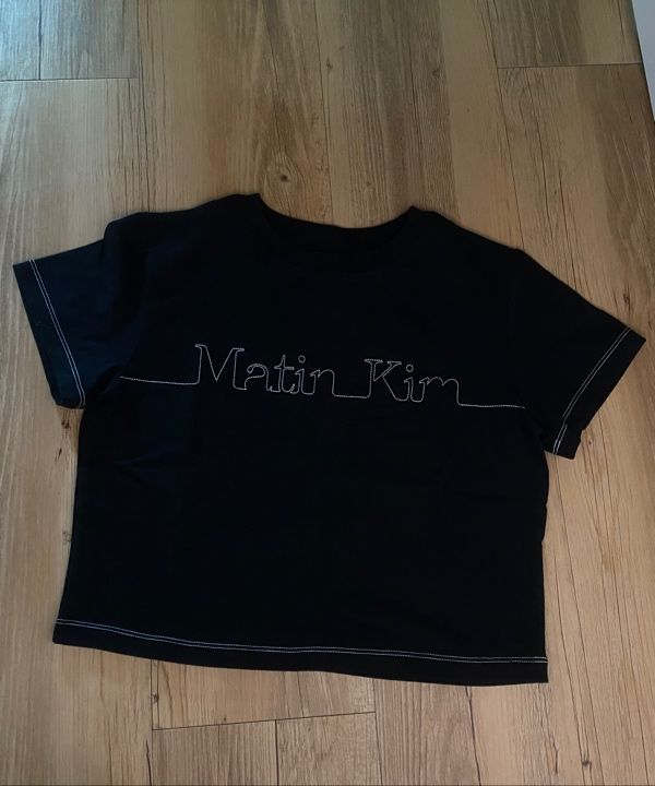 MUSINSA | MATIN KIM MATIN EDGE STITCH LOGO CROP TOP IN CHARCOAL
