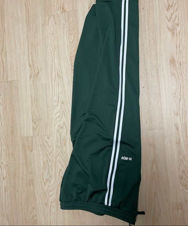 MUSINSA | NERDY Classic NY Track Pants (Black/Dark Green