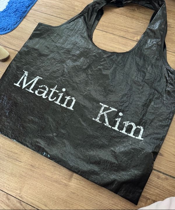 MUSINSA | MATIN KIM MATIN CRACKED LOGO GLOSSY ECOBAG IN