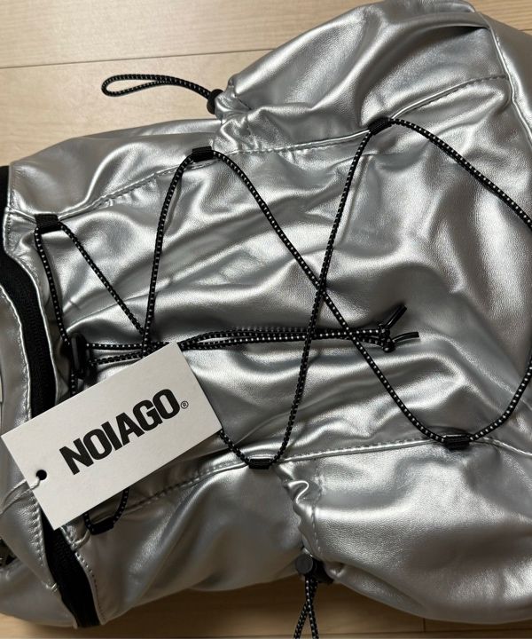 MUSINSA | NOIAGO NOI1386 String Symbol Backpack (Silver)