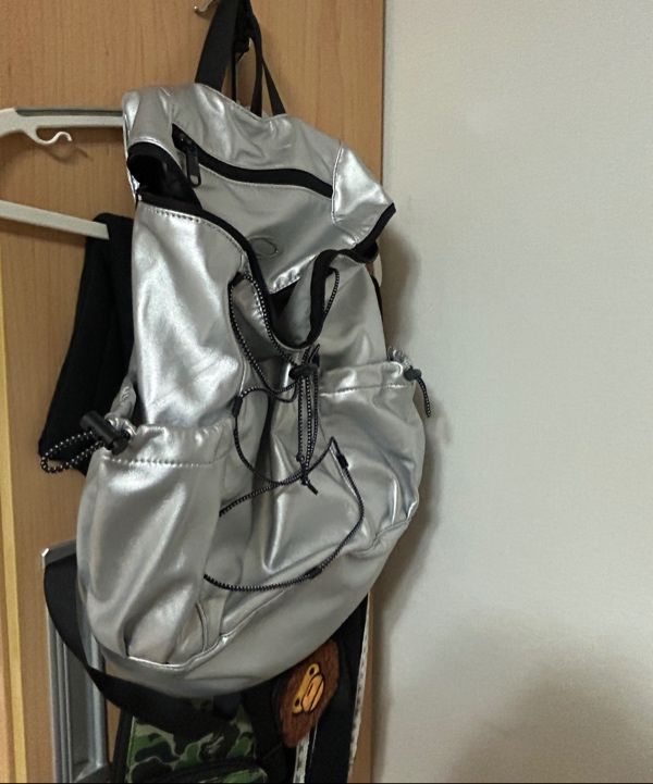 MUSINSA | NOIAGO NOI1386 String Symbol Backpack (Silver)