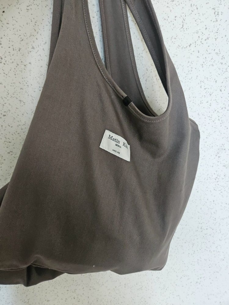 MUSINSA | MATIN KIM MATIN CRACKED LOGO ECOBAG IN CHARCOAL
