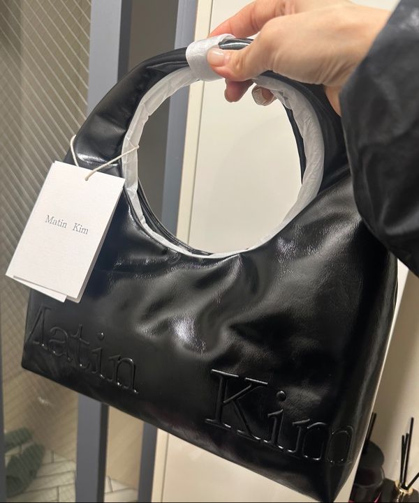 MUSINSA | MATIN KIM EMBOSSED LOGO LEATHER MINI TOTE BAG IN BLACK