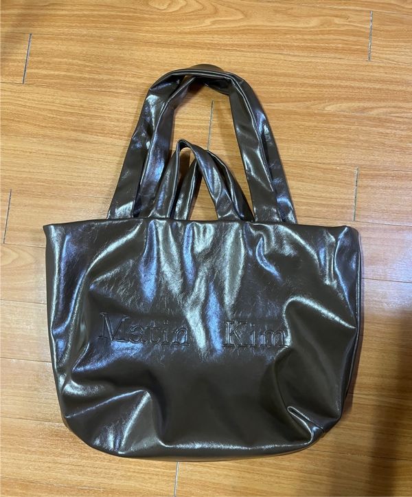 MUSINSA | MATIN KIM EMBOSSED LOGO LEATHER MAXI BAG IN BLACK