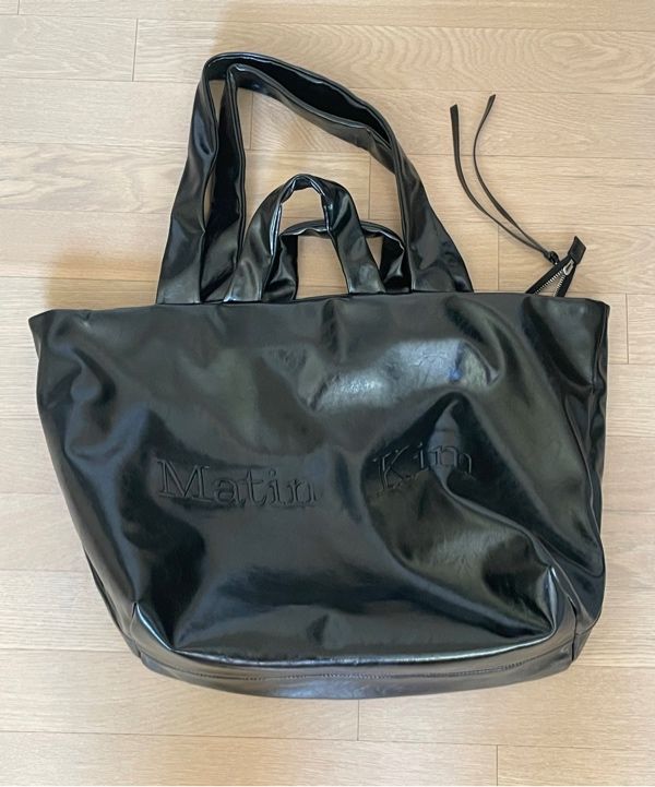 MUSINSA | MATIN KIM EMBOSSED LOGO LEATHER MAXI BAG IN BLACK