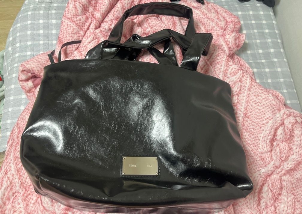 MUSINSA | MATIN KIM EMBOSSED LOGO LEATHER MAXI BAG IN BLACK