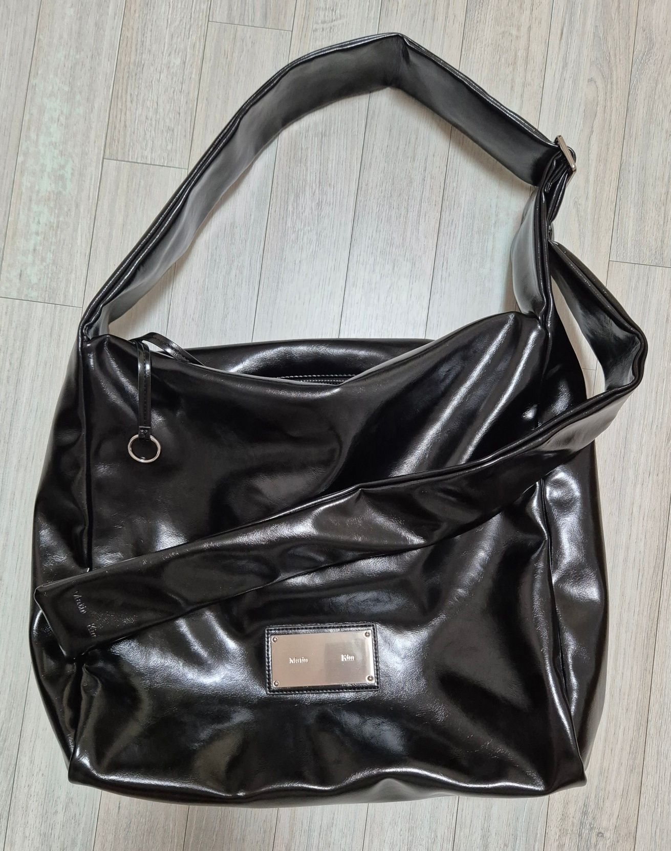 MUSINSA | MATIN KIM EMBOSSED LOGO LEATHER MAXI BAG IN BLACK