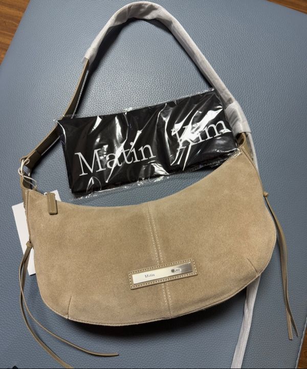 MUSINSA | MATIN KIM HALF MOON SUEDE LEATHER HOBO BAG IN KHAKI