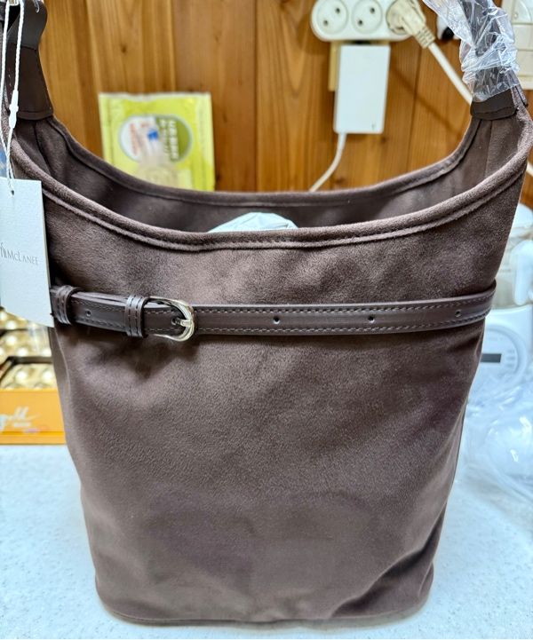 MUSINSA | MCLANEE Belted suede bucket bag