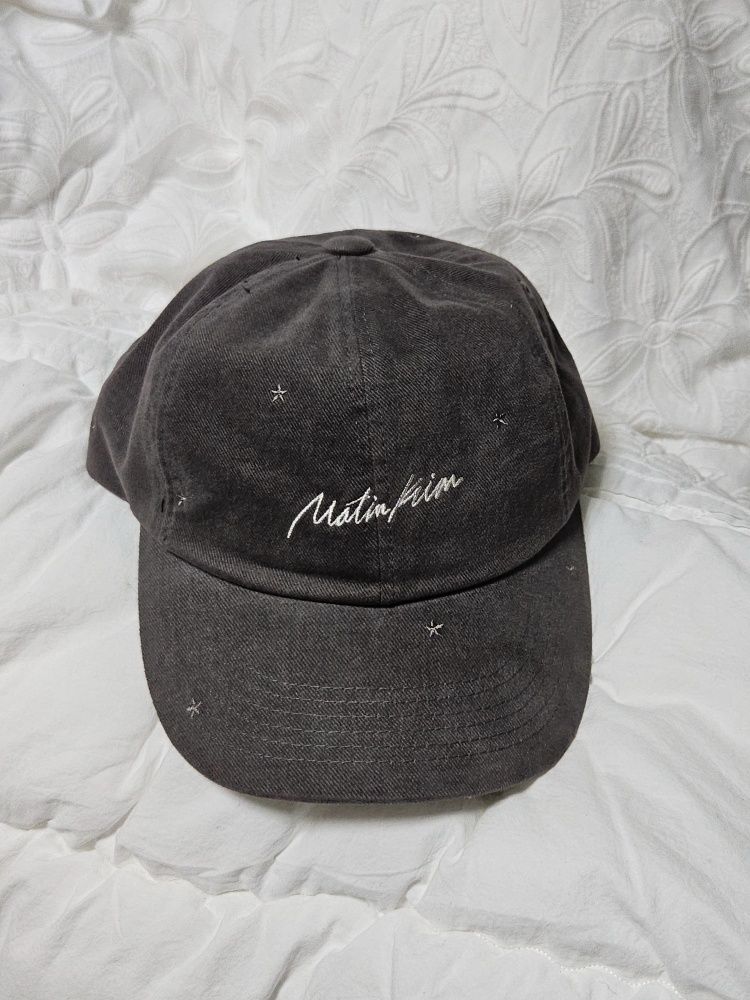 MUSINSA | MATIN KIM CURSIVE STAR EMBROIDERY BALL CAP IN DARK