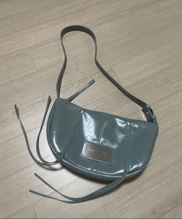 MUSINSA | MATIN KIM HALF SHIRRING RIBBON ROUND BAG IN SMOKE BLUE
