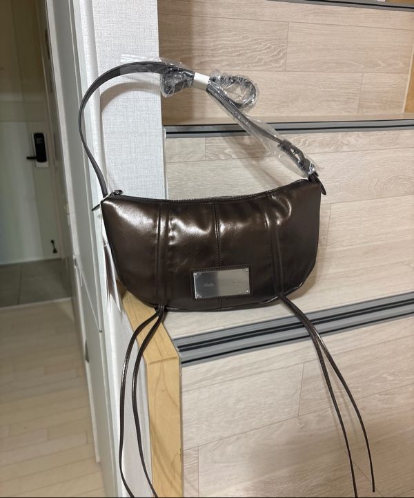 MUSINSA | MATIN KIM HALF SHIRRING RIBBON ROUND BAG IN BRONZE