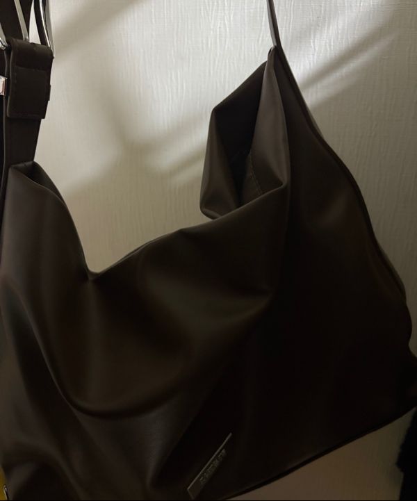 MUSINSA | ROCKCAKE Punching Belt Strap Shoulder Bag - Black