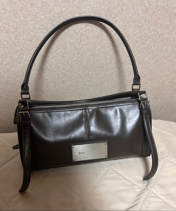 MUSINSA | MATIN KIM BUCKLE STRAP SHOULDER BAG IN BROWN