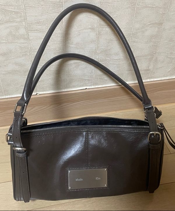 ショルダーバッグ・ポシェット [MATINKIM]buckle strap shoulder bag in brown MUSINSA | MATIN KIM BUCKLE STRAP SHOULDER BAG IN BROWN