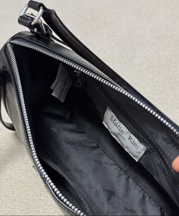 MUSINSA | MATIN KIM BUCKLE STRAP SHOULDER BAG IN BLACK