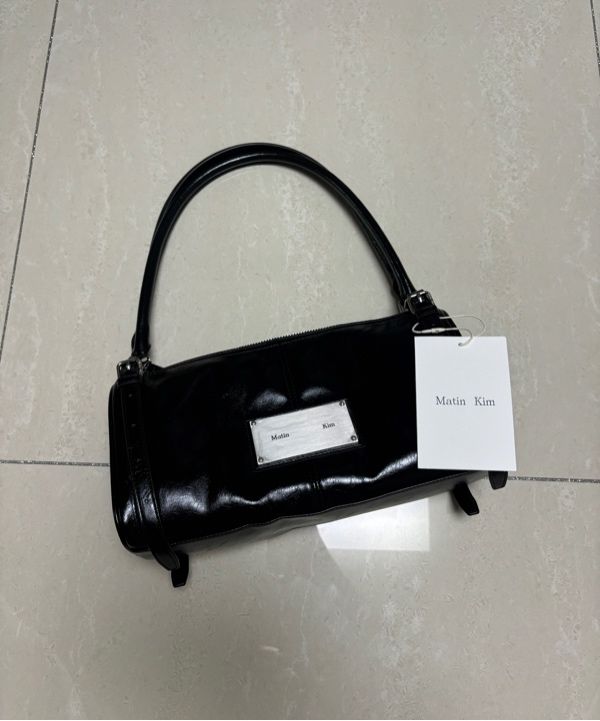 MUSINSA | MATIN KIM BUCKLE STRAP SHOULDER BAG IN BLACK