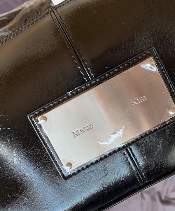 MUSINSA | MATIN KIM BUCKLE STRAP SHOULDER BAG IN BLACK