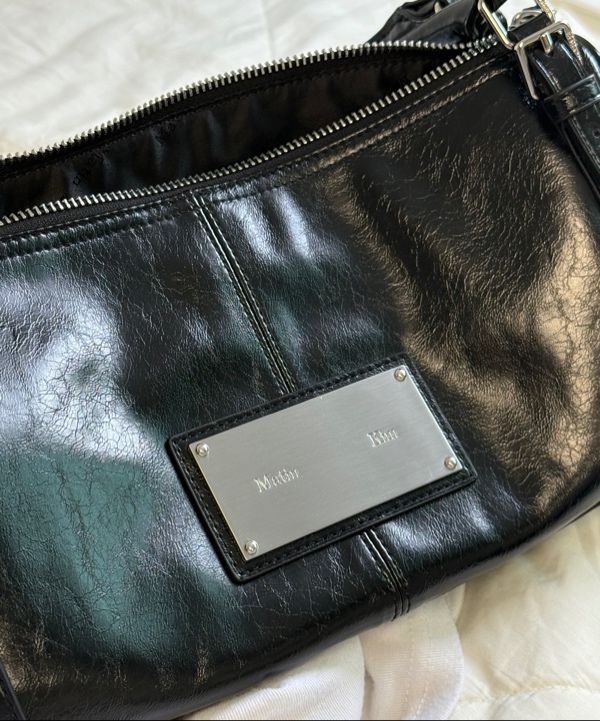 MUSINSA公式 | MATIN KIM BUCKLE STRAP SHOULDER BAG IN BLACK