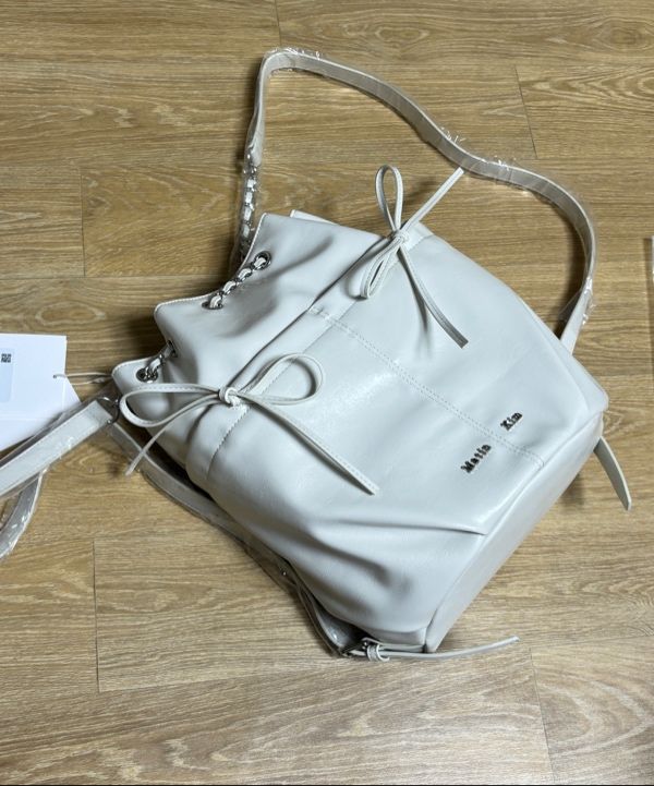 MUSINSA | MATIN KIM DRAW STRING RIBBON BACK PACK IN BLACK