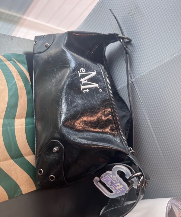 MUSINSA | MUCENT North Eyelet Leather Shoulder Bag Unisex