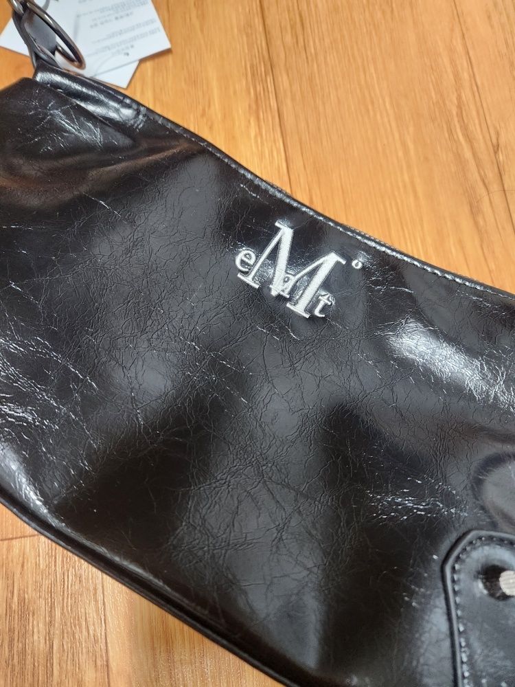 MUSINSA | MUCENT North Eyelet Leather Shoulder Bag Unisex