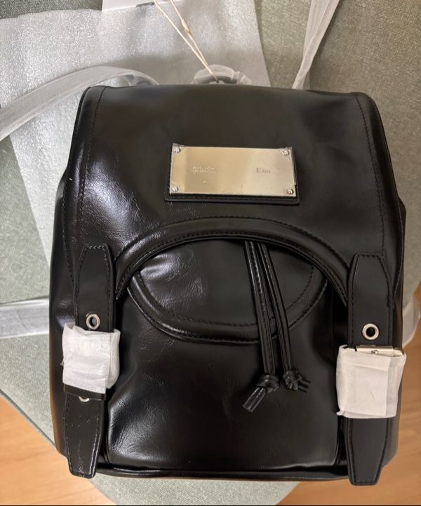 MUSINSA | MATIN KIM BUCKLE DETAIL BACK PACK IN BLACK