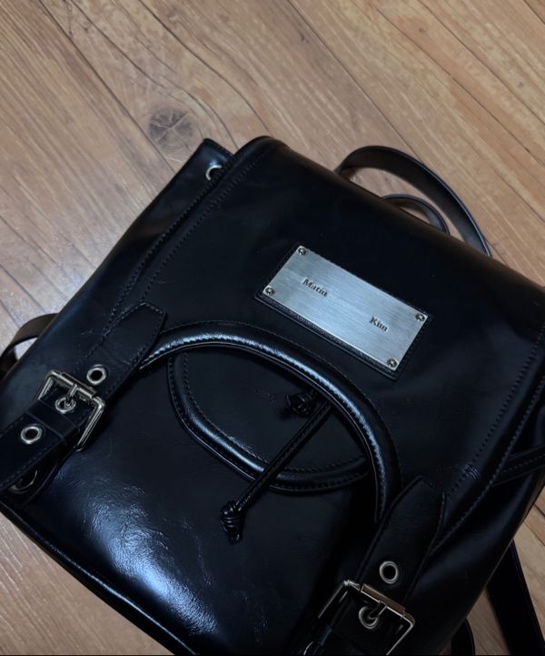 MUSINSA | MATIN KIM BUCKLE DETAIL BACK PACK IN BLACK