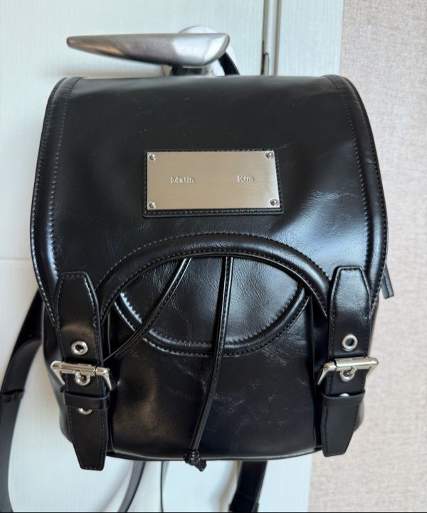 【Matin Kim】BUCKLE DETAIL BACK PACK MUSINSA | MATIN KIM BUCKLE DETAIL BACK PACK IN BLACK